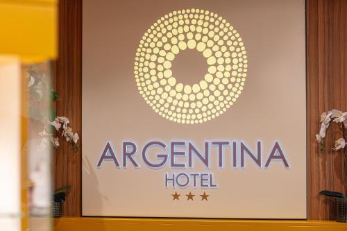 a sign for an argentinian hotel on a wall at Hotel Argentina in Grado