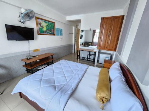 Ένα ή περισσότερα κρεβάτια σε δωμάτιο στο Ngoc Son Hotel