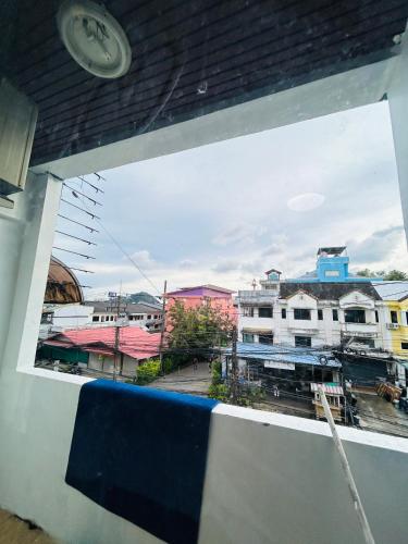 a view of a city from a window at DS Self service Apartment 02 in Phuket