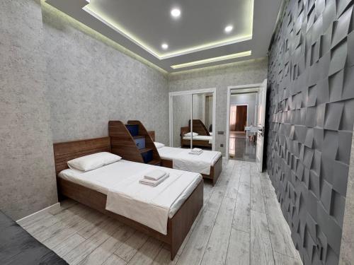 Postel nebo postele na pokoji v ubytování Demirchi Apartment