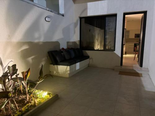 a living room with a couch and a window at Nomad suites in Al Madinah