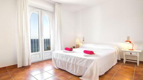 Ένα ή περισσότερα κρεβάτια σε δωμάτιο στο Casa la Pita de los Genoveses