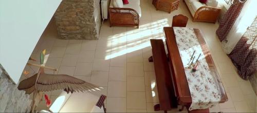 an overhead view of a living room with a floor at Saronic Citadel Seaside villa in Salamís