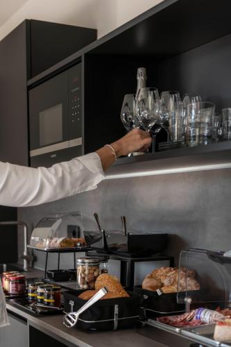 a chef is preparing food in a restaurant kitchen at Bfour in Pergine Valsugana