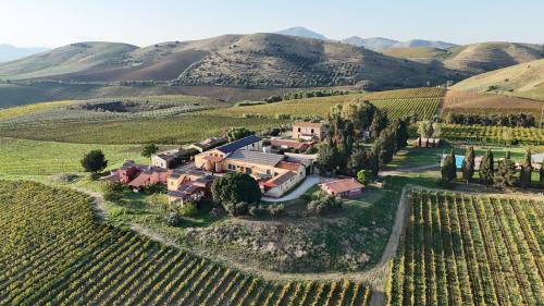 an aerial view of a estate in a vineyard at Tenuta dei Principi di Spadafora in Bosco Fraccia