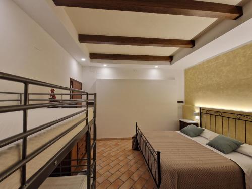 a bedroom with a bed and a balcony at B&B Casa Ciarpella in Montegranaro