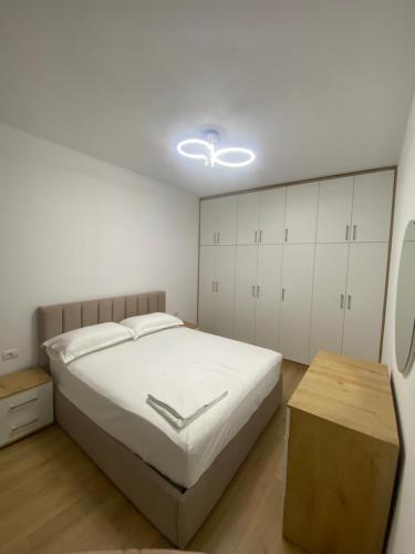 Ένα ή περισσότερα κρεβάτια σε δωμάτιο στο ST Apartments