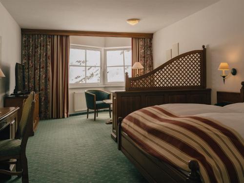 Posteľ alebo postele v izbe v ubytovaní Alpenhotel St.Christoph