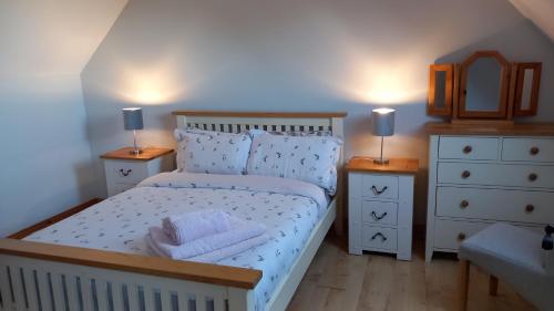Postel nebo postele na pokoji v ubytování Larchlodge