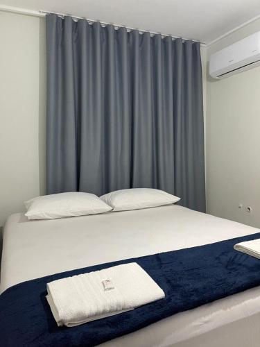 Katil atau katil-katil dalam bilik di Novo Hotel