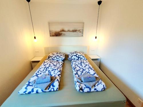 Un ou plusieurs lits dans un hébergement de l'établissement MOOKI Lake Apartment Ossiacher See&Gerlitzen