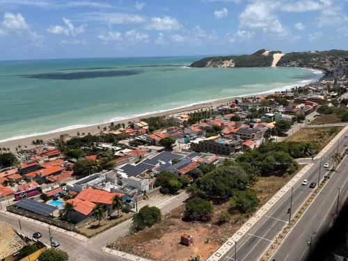 an aerial view of a town next to a beach at Paraíso Azul em Ponta Negra, Natal RN in Natal