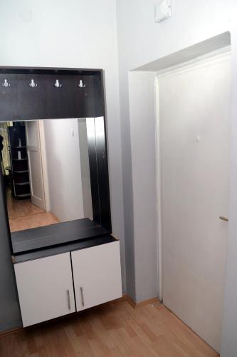 a mirror on top of a dresser in a room at Oki doki 2 in Bitola