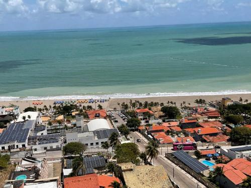 an aerial view of a city and the beach at Paraíso Azul em Ponta Negra, Natal RN in Natal