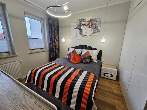 Katil atau katil-katil dalam bilik di Apartament Podskarpie