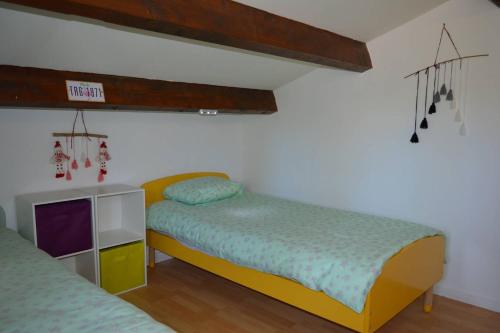 a bedroom with two beds and a small cabinet at Maison 4 pièces ARGELES SUR MER AR300-027 in Argelès-sur-Mer