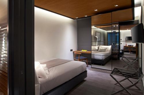 a bedroom with a bed and a living room at MET34 Athens in Athens