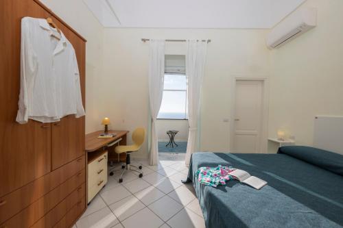 Postel nebo postele na pokoji v ubytování La casa di Ludo e Marti