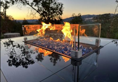 a fire pit on top of a table with flames at Spectacular vineyard views in Geyserville