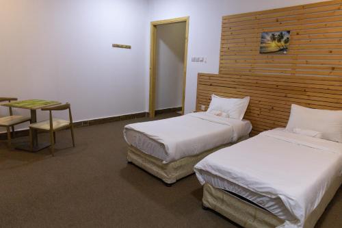 Ένα ή περισσότερα κρεβάτια σε δωμάτιο στο Beach Chalet - 3