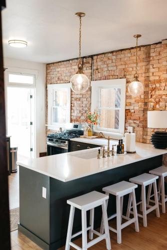 a kitchen with a large counter with stools at Ellerbeck Bed & Breakfast in Salt Lake City