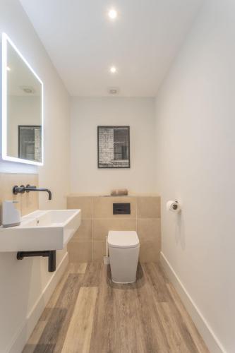 a bathroom with a toilet and a sink at Downs in Blewbury