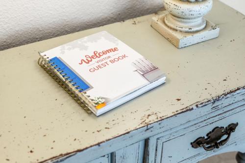 a book sitting on top of a table at Nocatee Retreat with Fenced Yard & Lanai in Sampson