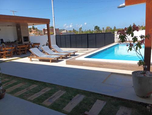 Πισίνα στο ή κοντά στο Casa beach Japaratinga