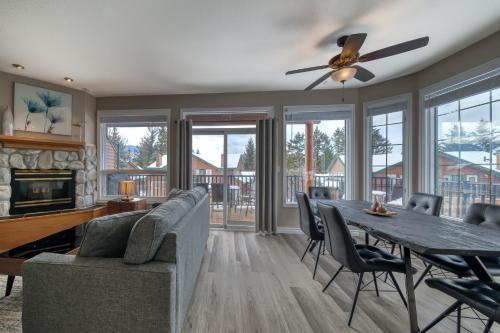 a living room with a table and a couch at Marble Canyon in Fairmont Hot Springs