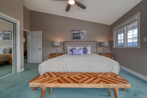 a bedroom with a large bed with a wooden headboard at Marble Canyon in Fairmont Hot Springs