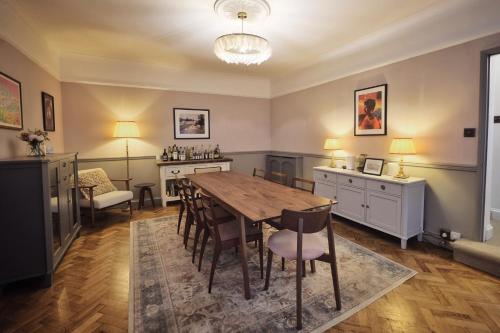 a dining room with a table and chairs at Coastal Cottage Escape in Ramsgate