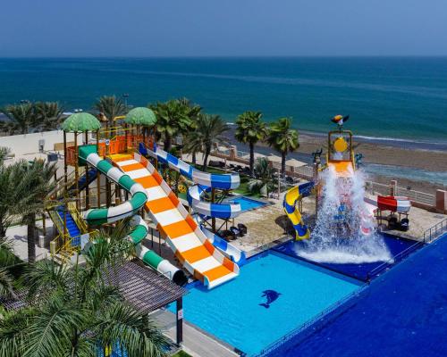 an image of a water park with a water slide at Radisson Blu Hotel & Resort, Sohar in Sohar