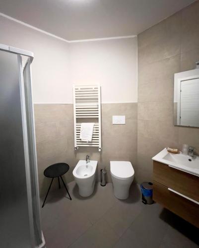 a bathroom with a toilet and a sink at Casa Celeste in Nocera Umbra