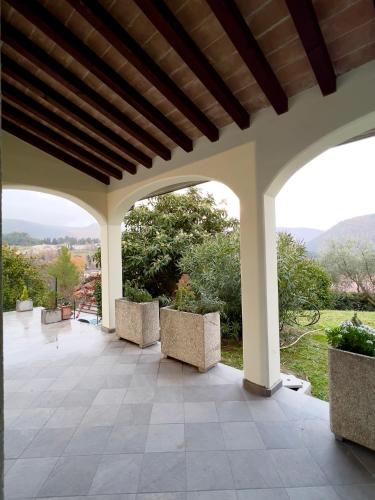 an outdoor patio with chairs and a view at Casa Celeste in Nocera Umbra