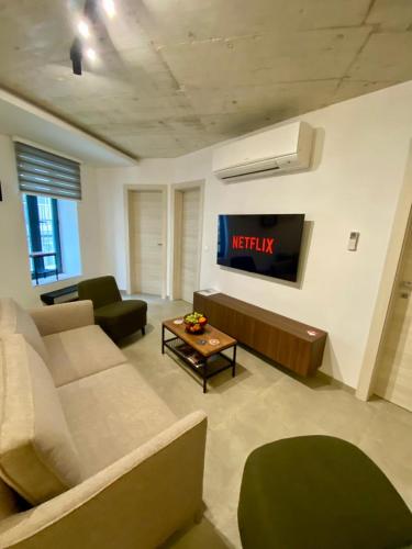 Cosy Modern Apartment in il-Gżiraにあるシーティングエリア