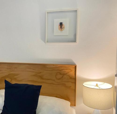 a bedroom with a bed and a picture on the wall at Studios Downtown Cancun in Cancún