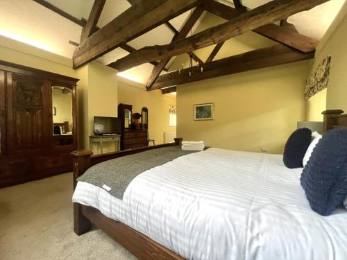 a bedroom with a large white bed in a room at The Farmhouse in Easington