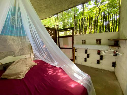 Postel nebo postele na pokoji v ubytování Casa Kuma