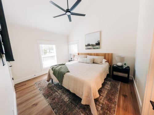 a bedroom with a bed and a ceiling fan at Little River Retreat in Townsend