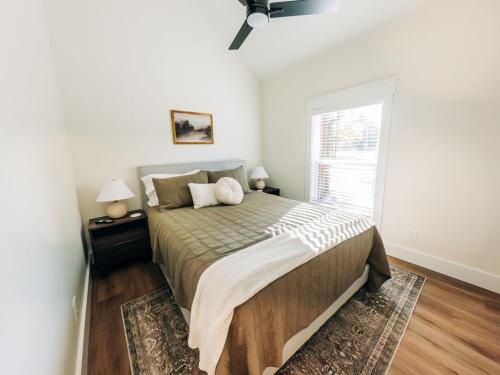 a bedroom with a large bed and a window at Little River Retreat in Townsend