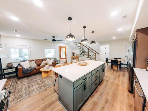 a kitchen and living room with a couch at Little River Retreat in Townsend