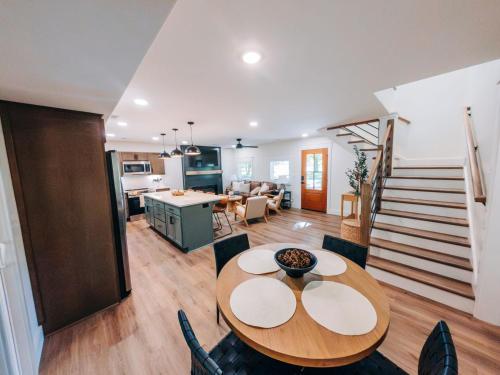 a dining room and kitchen with a table and chairs at Little River Retreat in Townsend