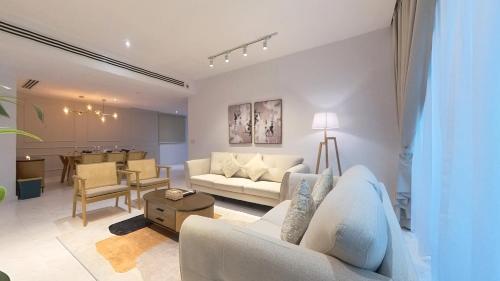 a living room with a couch and a table at Eaton Residence KLCC - KL SUITE in Kuala Lumpur