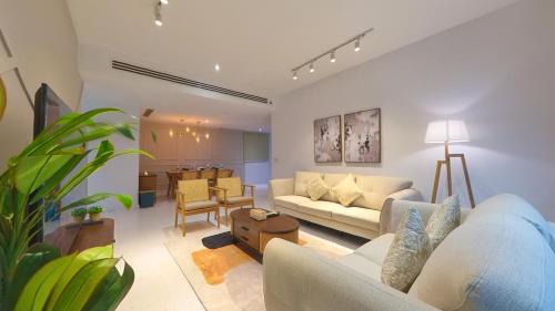 a living room with a couch and a table at Eaton Residence KLCC - KL SUITE in Kuala Lumpur