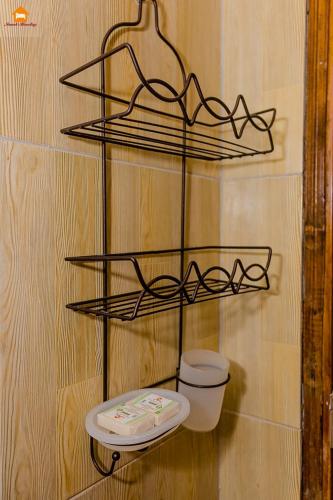 a shelf with a toilet on a wall at PAWA Homestays Studio California in Nanyuki