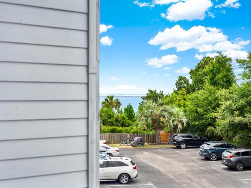 a view of a parking lot with cars parked at Bubbles in the Sand in Tybee Island