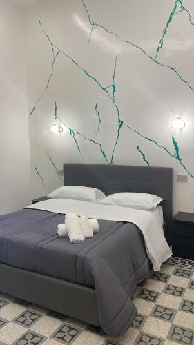 a bedroom with a large bed with two pillows at Maison Toledo 376 in Naples