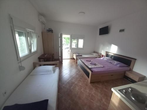 Кровать или кровати в номере Verige Apartments