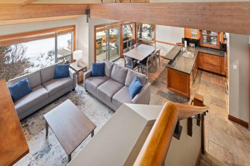 an overhead view of the living room and kitchen of a tiny house at Montebello by Whistler Premier in Whistler