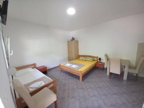 Кровать или кровати в номере Verige Apartments